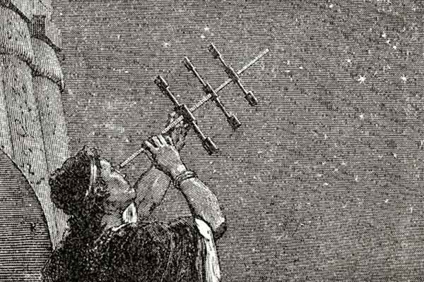 Man holding a strange star-gazing object to the sky